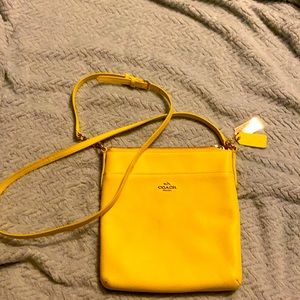 Pale yellow coach purse